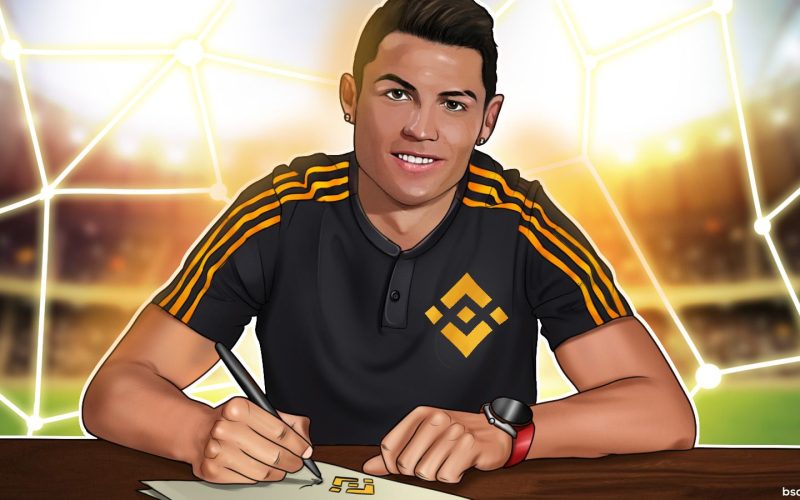 Image of Cristiano Ronaldo standing with a football, promoting Binance's auction for rare Portugal NFTs, offering a meet-and-greet experience.