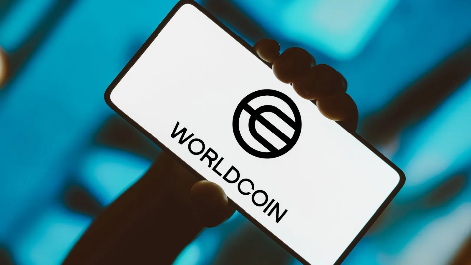 Worldcoin (WLD) logo displayed on a smartphone screen, symbolizing the cryptocurrency's price movement and market trends.