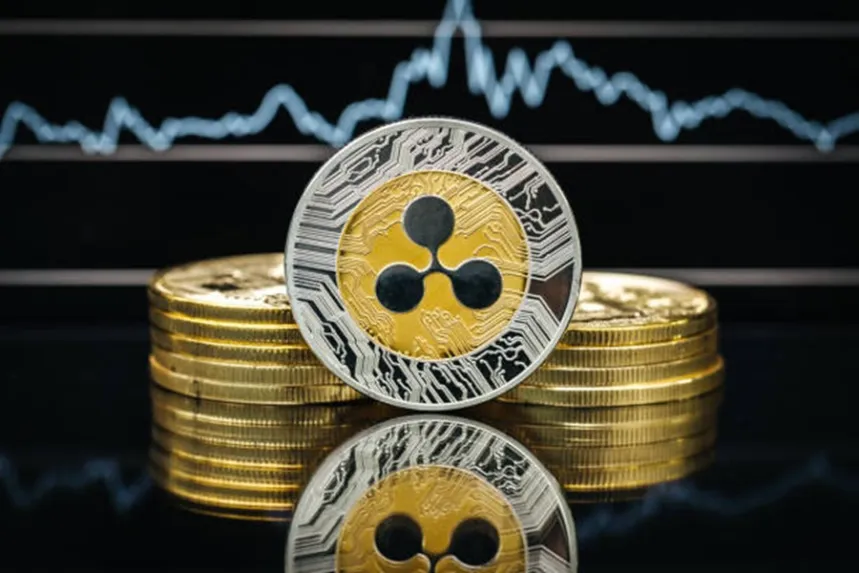 XRP coin with stock market chart and ETF text in background